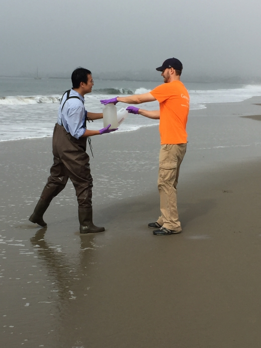 Dong Li and Jared Ervin (Geosyntec) sampling the surf zone for water quality research.